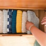 Woman organizing a drawer of clothing