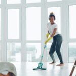 Woman mopping a floor during a home cleaning routine