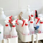 White cleaning bottles grouped in a portable container