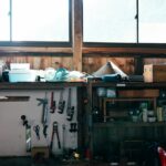 Organized garage storage with shelving, tools and clearly defined zones