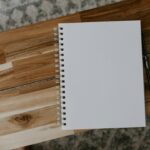 Spiral notebook on a table for tracking home maintenance records